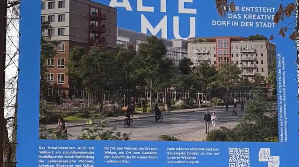 Ein Banner, auf dem mehrere Gebäude abgebildet sind, die bald durch große Bauarbeiten realisiert werden sollen