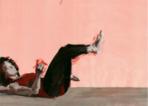 Eine Tänzerin in schwarzer Hose und rotem Top führt eine dynamische Bodenbewegung vor rosa Wand aus.